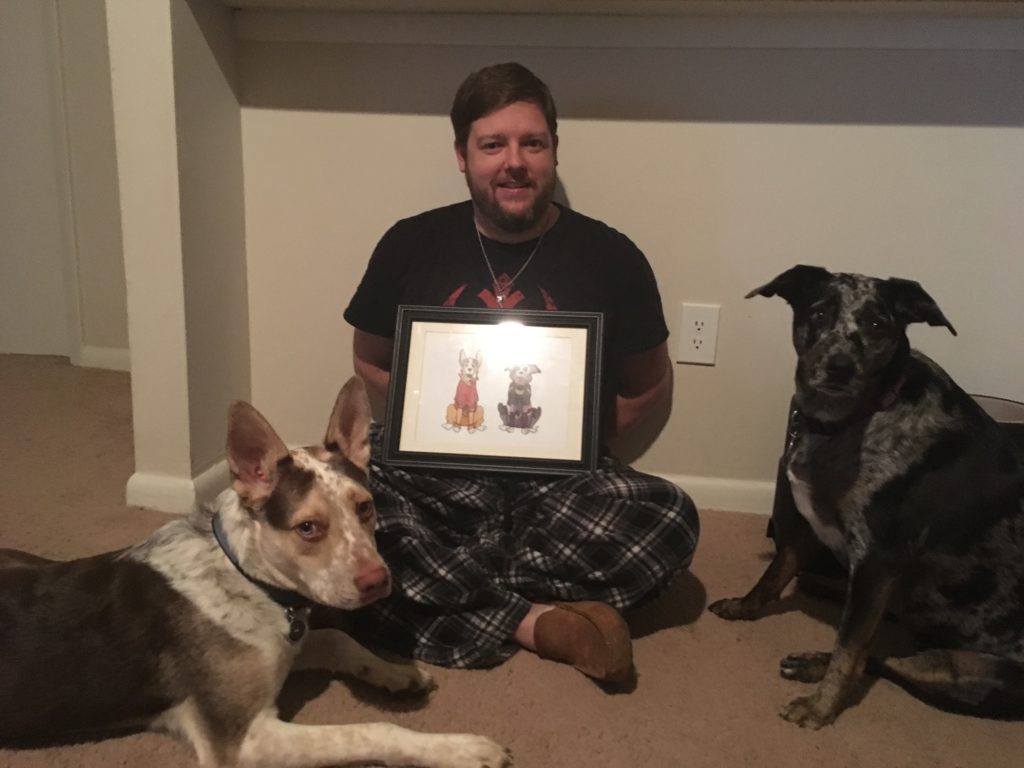Lauren's boyfriend with dogs and drawing